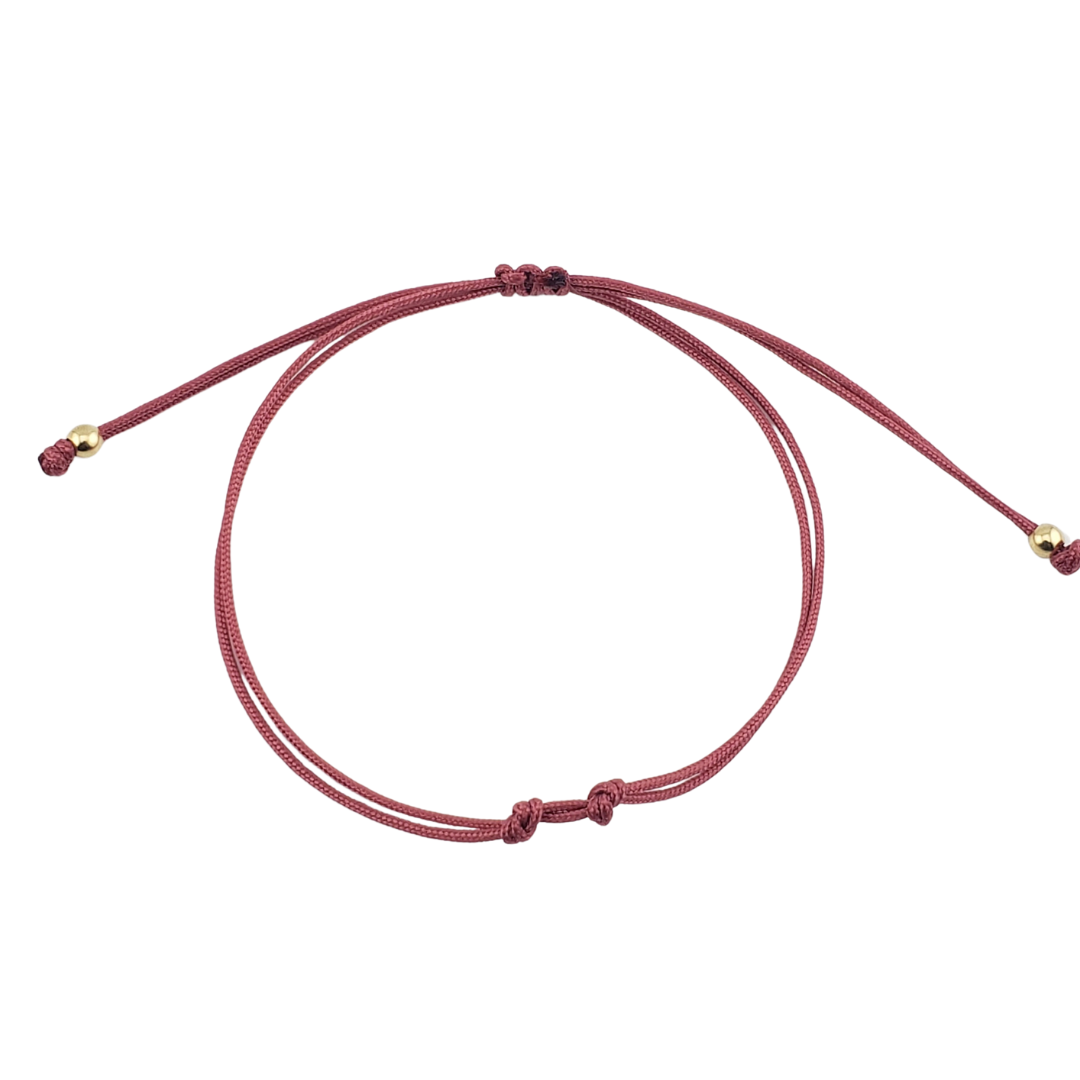 Pulseras hilos y 2 bolitas