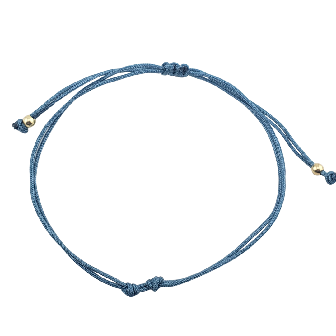 Pulseras hilos y 2 bolitas