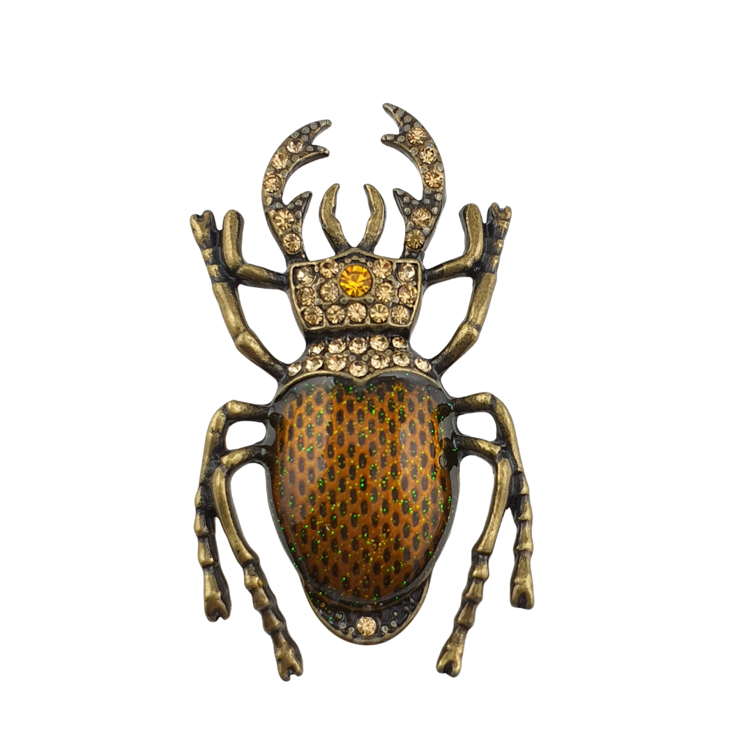 Broche escarabajo corona