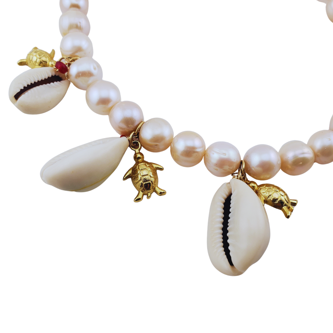 Collar perlas rosadas caracoles y tortugas