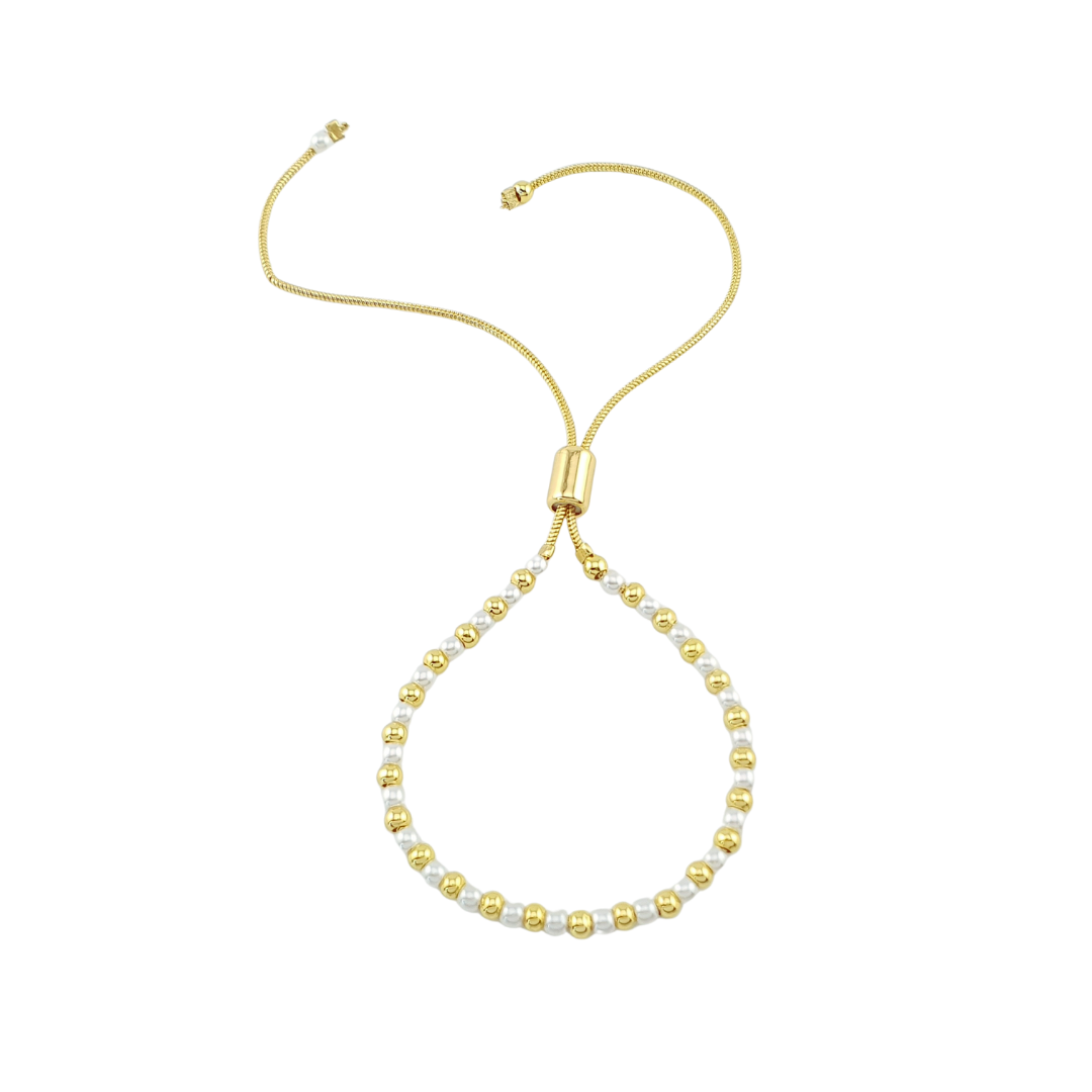 Pulsera de bolitas y perlas.