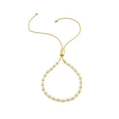 Pulsera de bolitas y perlas.