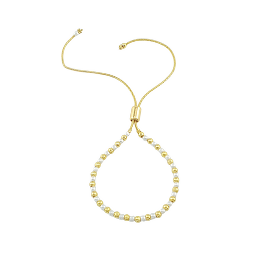 Pulsera de bolitas y perlas.