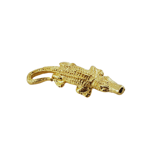 Broche cocodrilo.